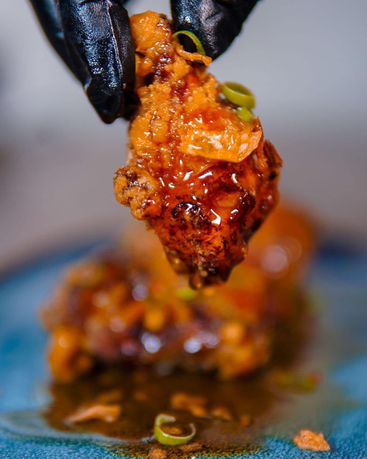 A freshly sauced Bare Bones wing